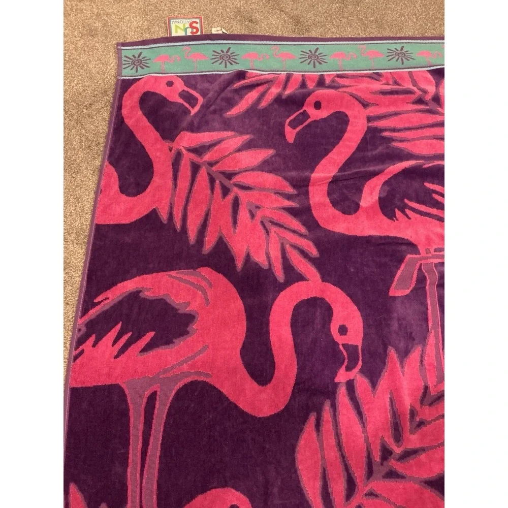 Pink and purple flamingo design cotton beach towel by Jay Franco & Sons